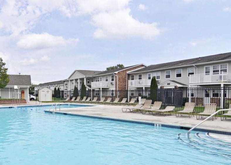Hawthorne Court Apartments swimming pool area with surrounding apartments
