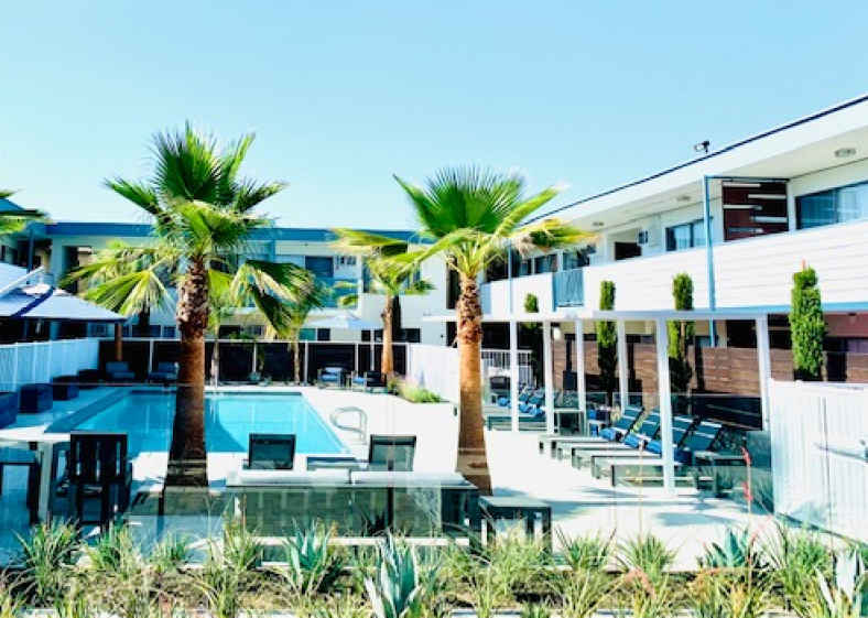 Atrium at West Covina exterior facade and pool area