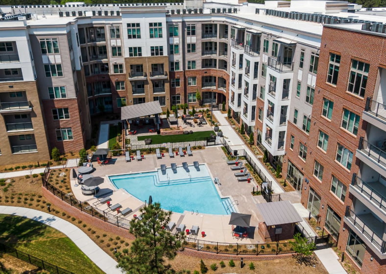 Apartment building and pool area aerial view