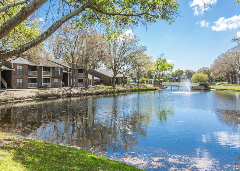 Apartment complex exterior located near pond